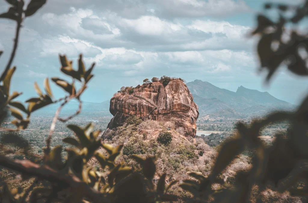 brown rock formation near body of water during daytime central province
