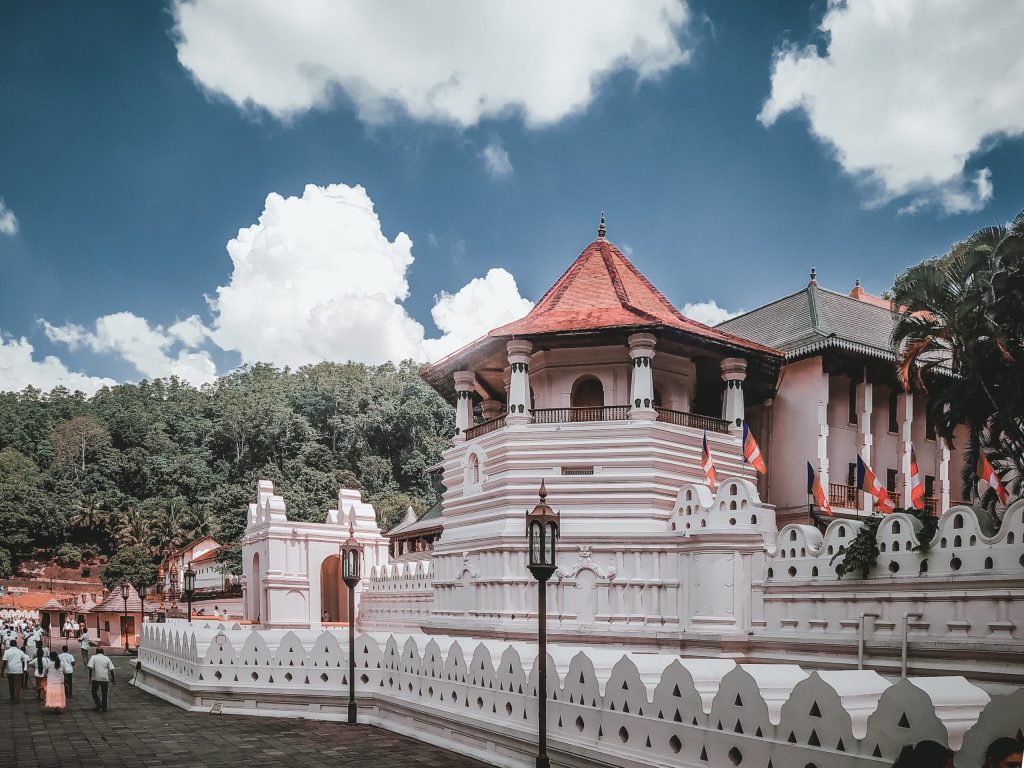 The Temple of the Sacred Tooth Relic is a world-renowned place of worship, where the left Canine tooth of Gautama Buddha is enshrined. The temple which is venerated by thousands of local & foreign devotees and tourists daily was named as a world heritage by UNESCO in 1988. The temple which carries a lot of value to Buddhists all over the world also has immense cultural value. The architecture is of unique Kandyan architectural style with a combination of the unique style used to build “Dalada Mandira” the shrines which housed the Sacred Tooth Relic previously in other kingdoms.