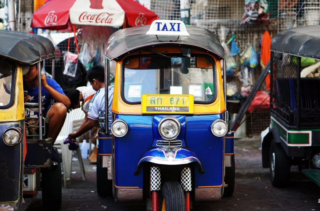 yellow and blue tuktuk in bangla road phuket