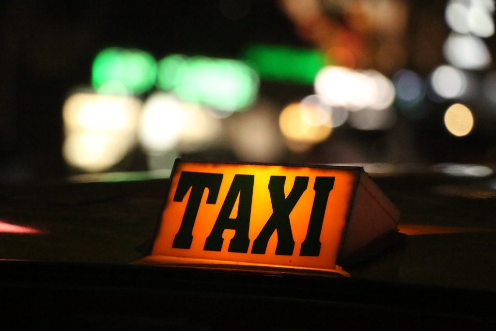 orange and black taxi sign