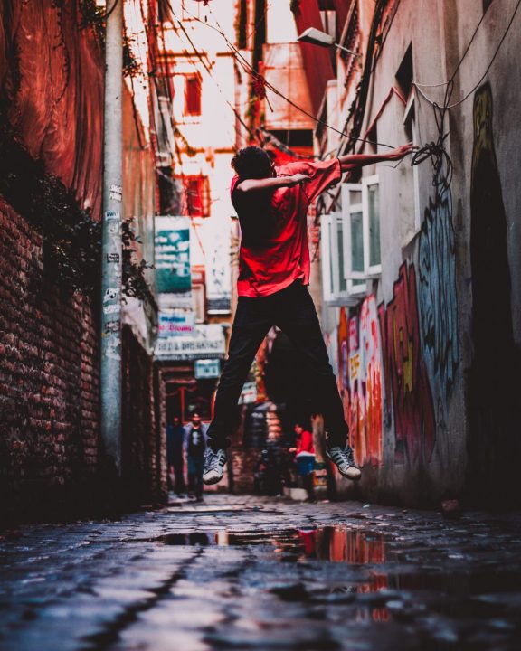 lime-lapse photography of man jumping