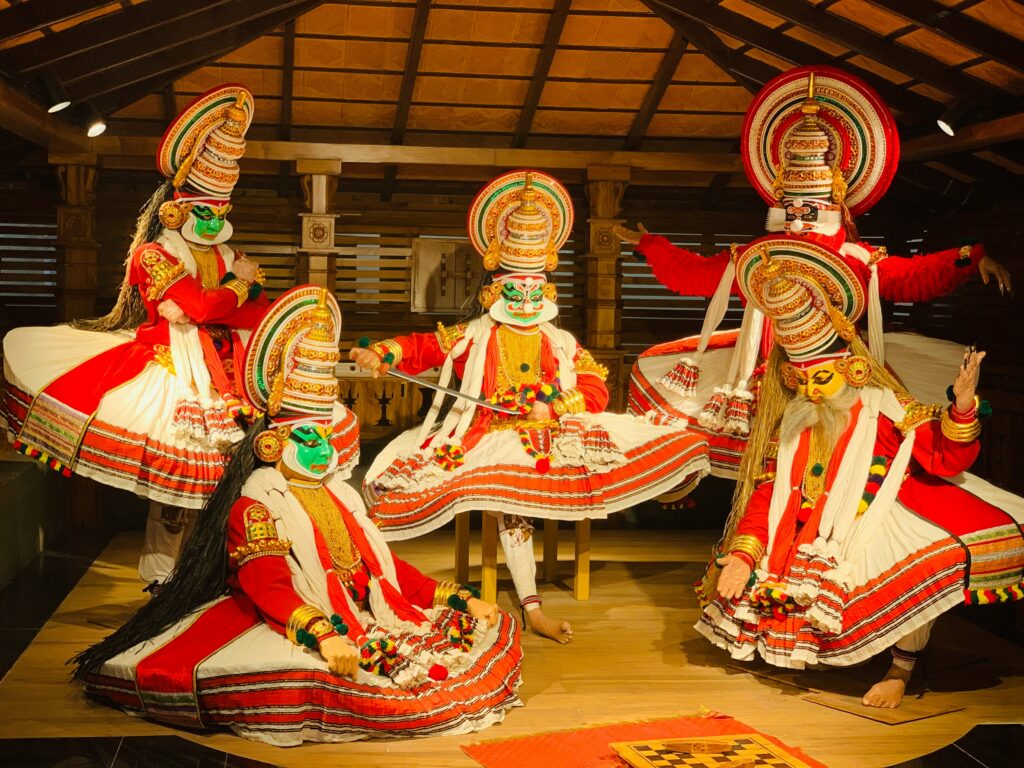 Kathakali actor in green paccha facial makeup and elaborate golden crown performing expressive eye gestures