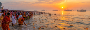 Thousands of pilgrims floating earthen lamps at sunrise on Dublar Char beach during Rash Mela in the Sundarbans