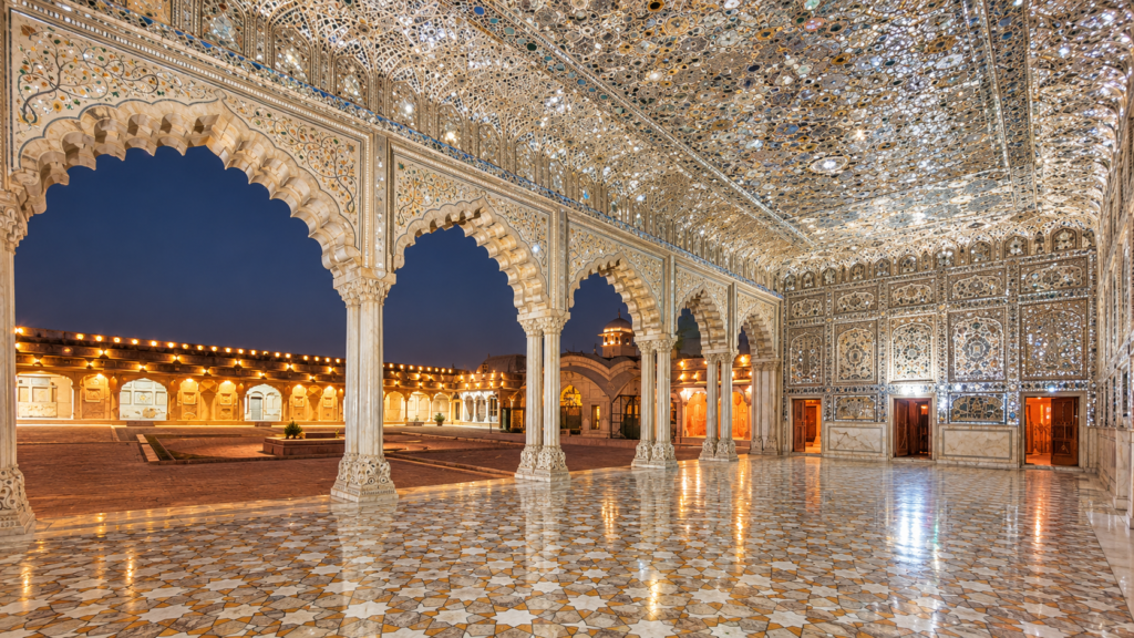 Ornate glass mirror work and marble craftsmanship inside Sheesh Mahal at Lahore Fort.